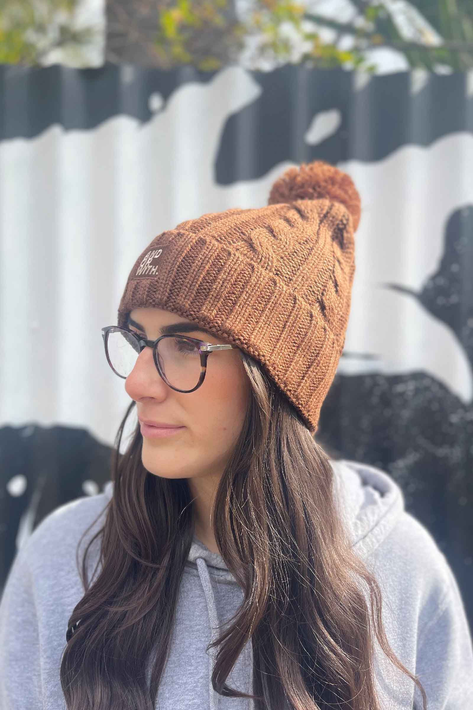 unisex-brown-wool-cable-knit-beanie-andorwith-surf-skate-wear