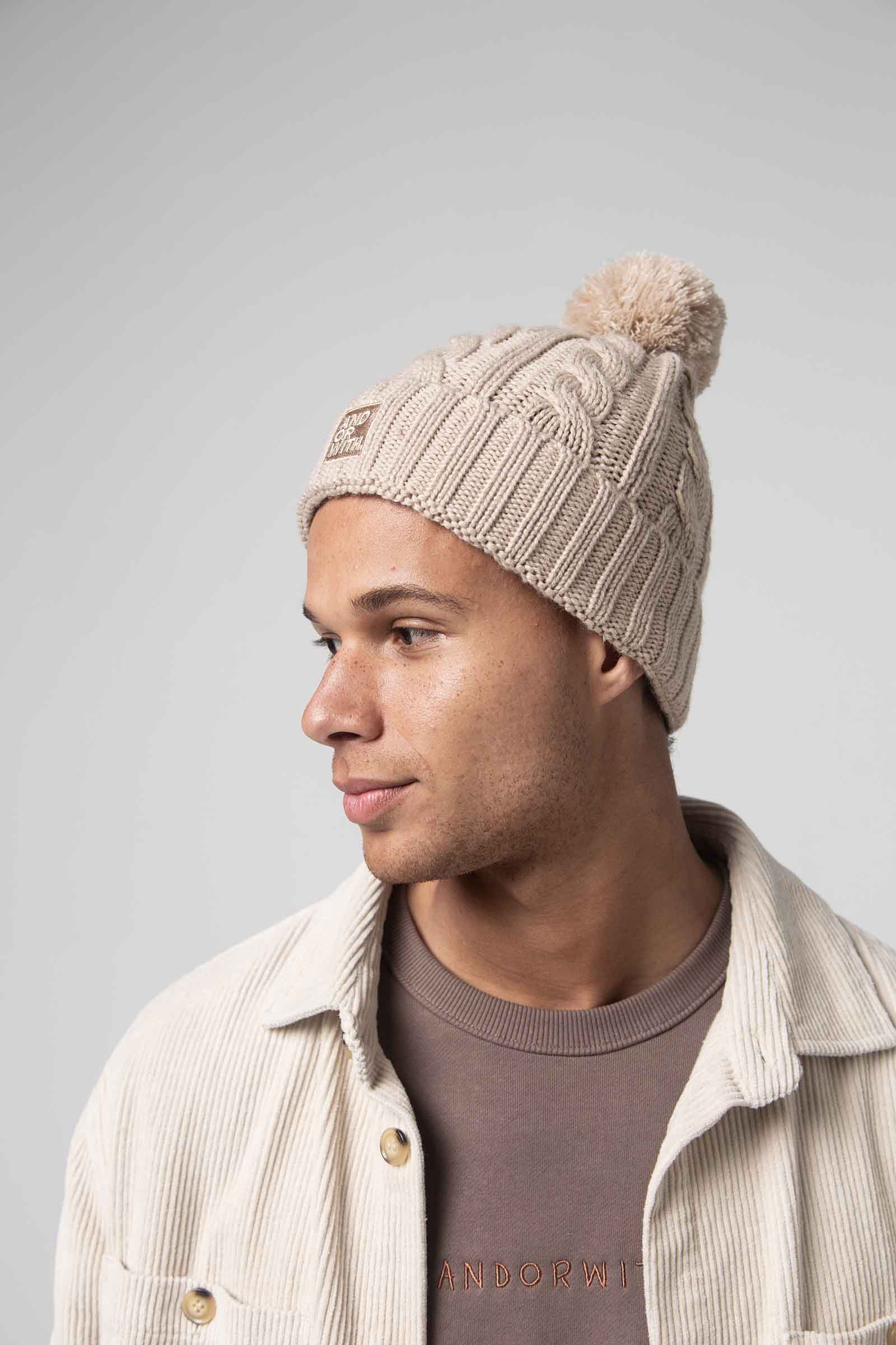 unisex-cream-wool-cable-knit-beanie-andorwith-surf-skate-wear