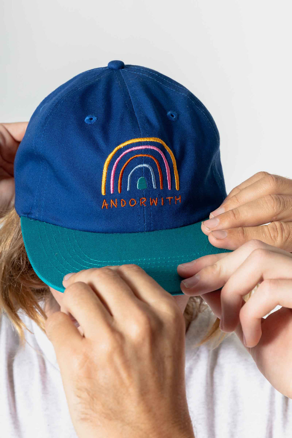 unisex_snapback-hat-blue-andorwith-surf-skate-wear