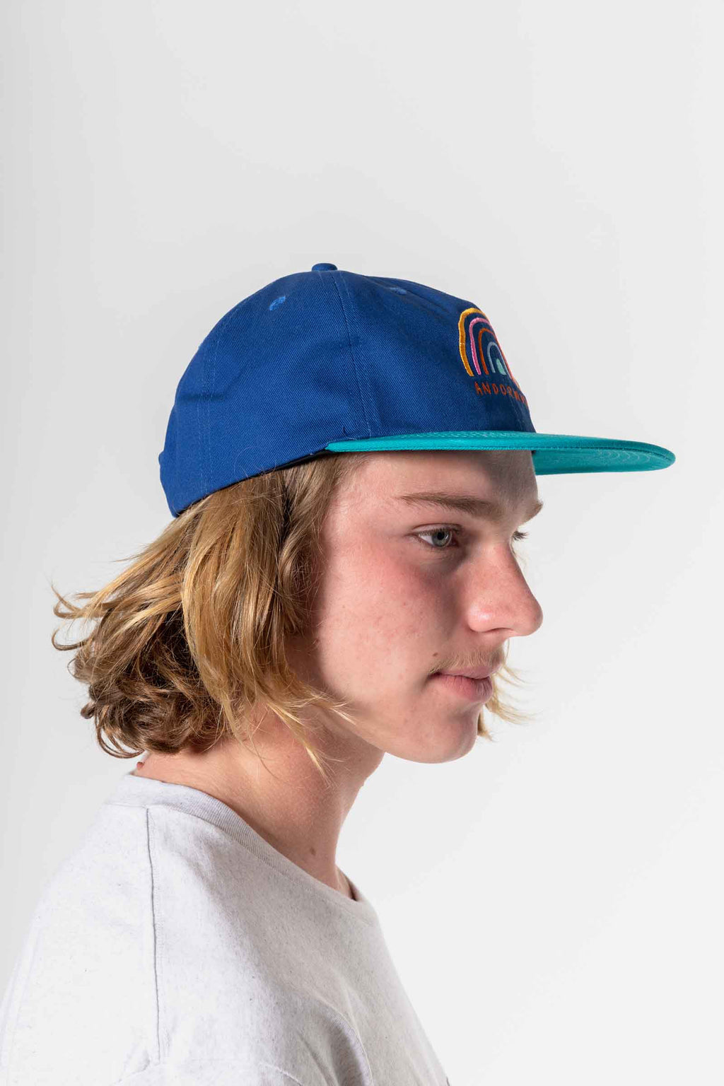 unisex_snapback-hat-blue-andorwith-surf-skate-wear